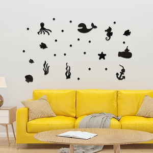 Black acrylic ocean animal wall stickers including whale and octopus on a white wall