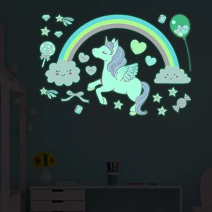 Luminous wall stickers set with glowing unicorn and rainbow in a dark children's bedroom