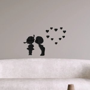 Detailed view of black acrylic mirror wall stickers featuring boy and girl silhouettes
