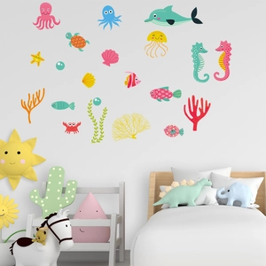 Luminous ocean animal wall stickers with octopus and turtle in a cozy nursery bedroom