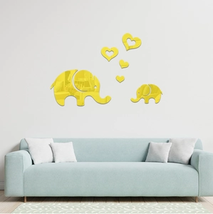 Detail of yellow mirror acrylic wall decals showing elephant family and heart shapes