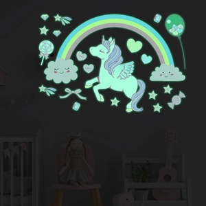 Luminous unicorn and rainbow wall stickers glowing in a dark kids room for decor