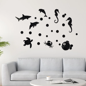 Detailed close-up of 3D black acrylic ocean creature wall stickers in a modern living room