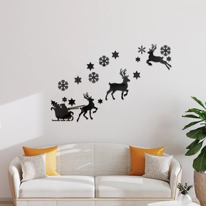 Detail view of black acrylic Santa sleigh and reindeer wall stickers in a cozy living room