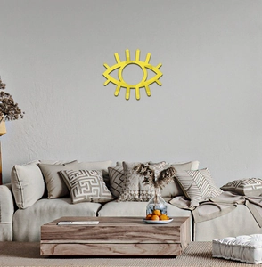 Detailed view of the gold eye-shaped acrylic mirror wall decor with long eyelashes