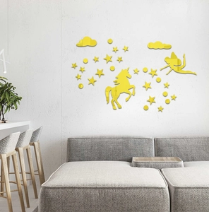 Detail of yellow mirror acrylic wall decals with unicorn and fairy for nursery decor