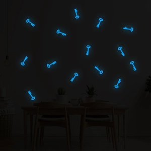 Luminous blue key wall stickers glowing in a dark room setting for home wall decoration