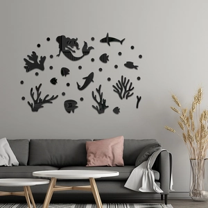 Modern black acrylic mermaid and sea life wall stickers above a gray living room sofa