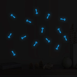 Luminous blue key-shaped wall stickers glowing in the dark for bedroom decor