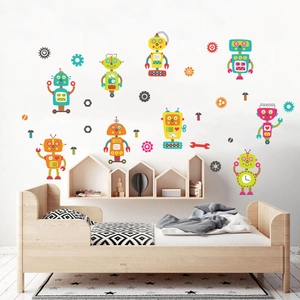 Detailed view of glow-in-the-dark blue robot wall stickers in a cozy children's bedroom