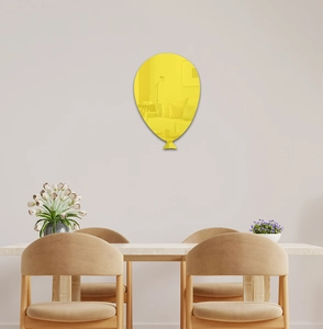 Detailed view of balloon shaped yellow acrylic 3D mirror wall sticker in a modern room