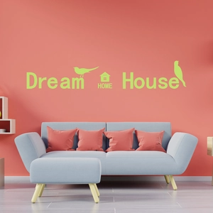 Detail showing Dream House luminous wall stickers with birds on a bright orange wall