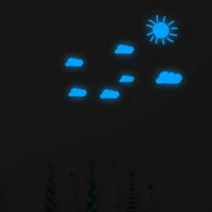 Detail of glow-in-the-dark wall stickers showing sun and clouds in ice blue fluorescent light