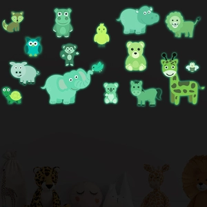 Detail of glow-in-the-dark wall stickers featuring cartoons of lions, giraffes and elephants