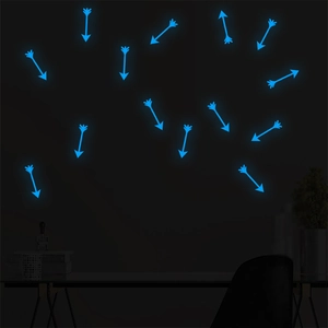 Glow in the dark blue arrow wall stickers in a dark bedroom setting for children