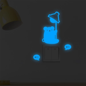 Luminous wall sticker showing glowing cartoon mouse and ON/OFF switch markers in the dark