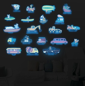 Luminous transport wall stickers including planes and trucks glowing in a dark kid's room