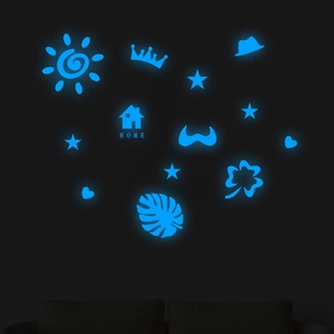 Luminous blue wall stickers featuring stars, moon, and house on dark wall decor