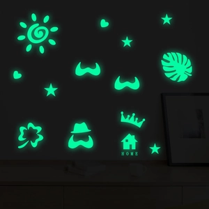 Green glowing wall stickers with stars, hearts, and sun shapes for bedroom decor