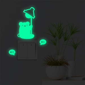 Luminous koala wall sticker with ON/OFF labels glowing in the dark near a light switch