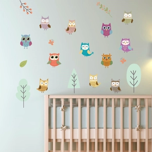 Cartoon owl glow in the dark wall stickers displayed in a cozy nursery room setting