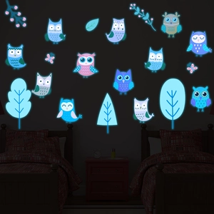Glow-in-the-dark owl and tree wall stickers showing blue luminous effect in kids' bedroom