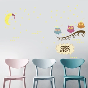 Detailed wall sticker set with glowing moon, stars, and owls for a cozy kids room decor