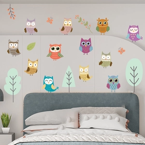 Detailed bedroom scene featuring glowing owl wall stickers and decorative branches