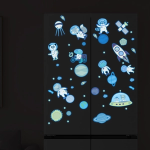 Luminous space themed astronaut animal stickers glowing blue in dark on a fridge