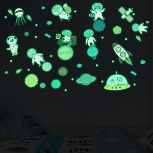 Luminous space wall decals for kids room featuring glowing animals and planets in the dark