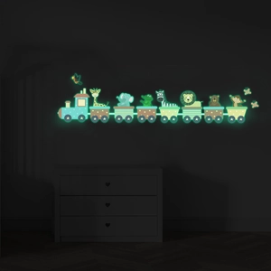 Luminous wall stickers featuring cartoon animals on a train glowing in dark children's room
