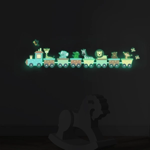 Luminous cartoon animal train wall stickers showing green glow effect in a dark kids room