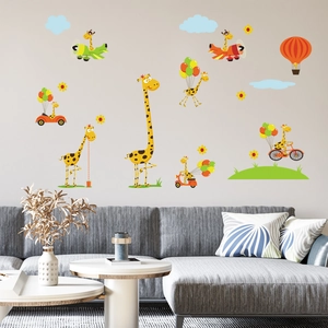 Detailed view of luminous cartoon giraffe stickers applied to a modern living room wall