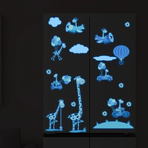 Detailed view of luminous cartoon giraffe stickers glowing blue on a dark fridge surface
