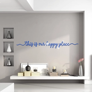 Détail du sticker mural en acrylique bleu 'this is our happy place' avec effet 3D
