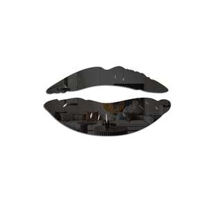 Detail of red lip shaped acrylic mirror wall sticker showing clear surface reflection