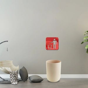 Modern cream round trash bin with red disposal sign wall sticker for indoor home decor