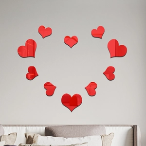 Modern wall decor featuring red heart-shaped acrylic mirror stickers arranged on a wall