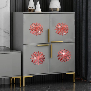 Set of 4 red floral acrylic mirror wall stickers on a modern grey cabinet surface