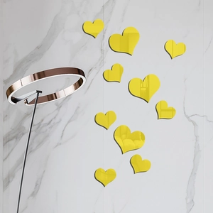 Set of 10 yellow acrylic mirror heart wall stickers for home decoration on marble wall