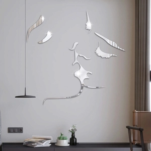 Detail of silver acrylic mirror wall sticker featuring a romantic kiss silhouette