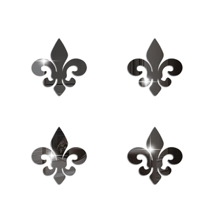 Detail view of four pieces of reflective fleur-de-lis mirror acrylic wall stickers for decor