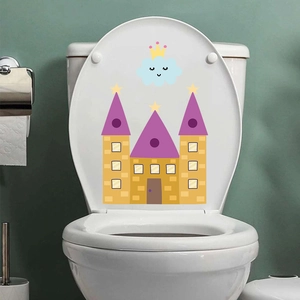 Detail of cartoon castle and blue cloud sticker applied on a white toilet lid cover
