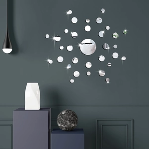 Modern set of circular acrylic mirror wall stickers arranged in a luxury living room setting