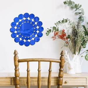 Close-up of blue acrylic round mirror wall stickers in creative sunburst pattern