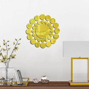 Modern set of round gold acrylic mirror wall stickers arranged in a floral design