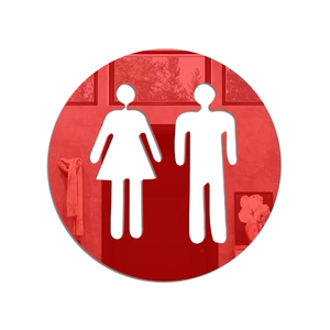 Detail of red circular acrylic restroom sign with white male and female cutout icons