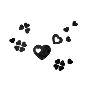 Detail of black acrylic heart wall stickers with high-gloss mirror reflective surface