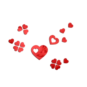 Macro detail of red 3D mirror acrylic heart-shaped wall stickers and clover design
