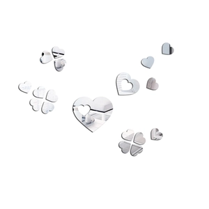 Detail of silver mirror acrylic heart wall stickers showing reflective 3D surface effects